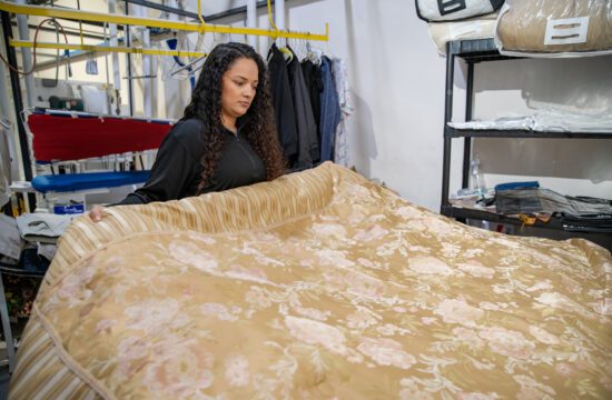 a ZIPS employee handles a comforter
