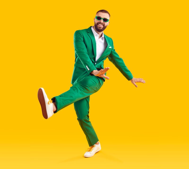 Guy wearing green suit dancing